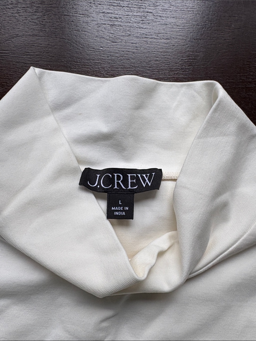 J. Crew Cream Turtleneck super soft w flaw (makeup) inside of neck. Not visible